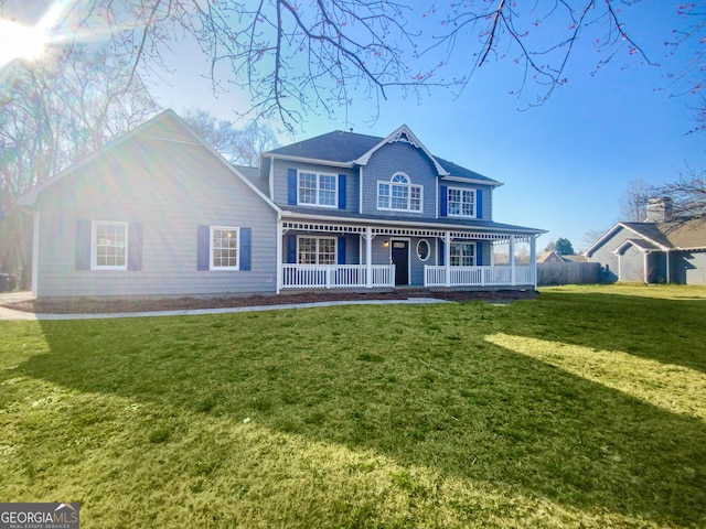 view of front of property with a porch and a front lawn