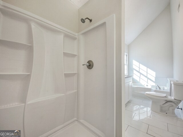 bathroom featuring lofted ceiling, tile flooring, toilet, and walk in shower