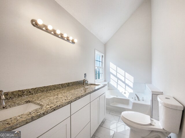 bathroom featuring tile flooring, lofted ceiling, toilet, vanity, and a bath