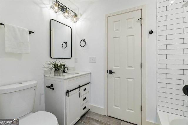 bathroom featuring vanity and toilet