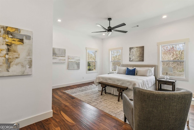 bedroom with ceiling fan and dark hardwood / wood-style floors