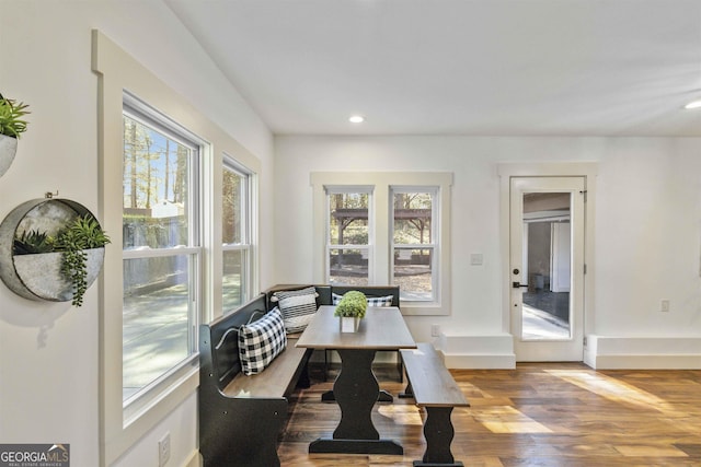 dining space with hardwood / wood-style flooring