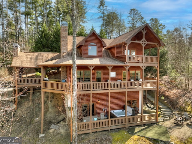 rear view of house with a balcony