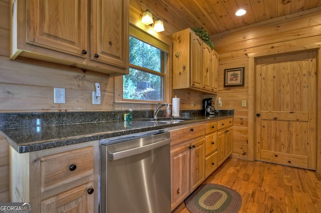 kitchen with wood walls, wood ceiling, light hardwood / wood-style floors, dark stone counters, and stainless steel dishwasher