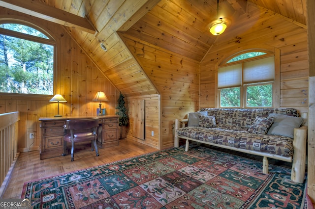 office space with hardwood / wood-style floors, vaulted ceiling with beams, wooden walls, and wooden ceiling