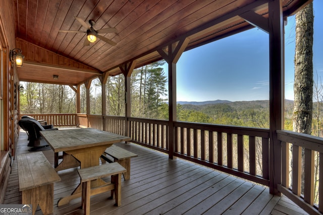 wooden deck featuring ceiling fan