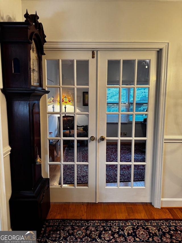 interior space with french doors and wood-type flooring