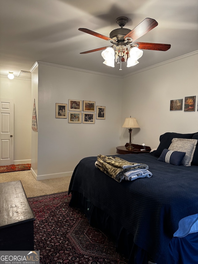 carpeted bedroom with ornamental molding and ceiling fan