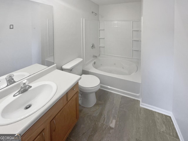 full bathroom featuring hardwood / wood-style floors, vanity, toilet, and shower / tub combination