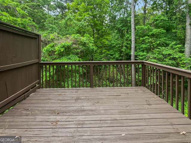 wooden deck featuring a wooded view
