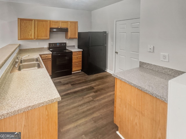 kitchen with dark hardwood / wood-style flooring, sink, and black appliances