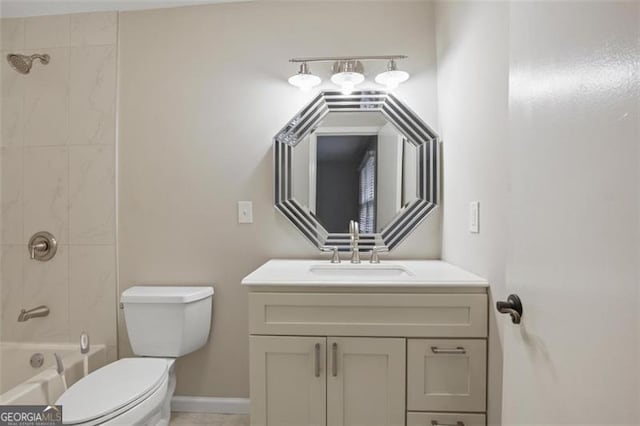 full bathroom featuring toilet, tiled shower / bath combo, and vanity