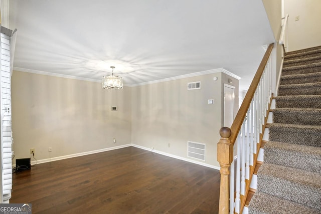 interior space with crown molding, dark hardwood / wood-style floors, and a notable chandelier