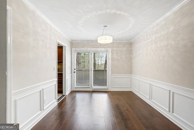 unfurnished dining area featuring dark wood-type flooring and ornamental molding