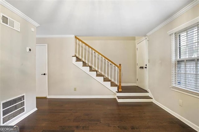 interior space featuring dark hardwood / wood-style floors and ornamental molding