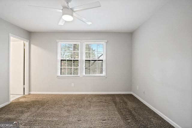 spare room with ceiling fan and carpet flooring