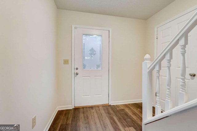 foyer entrance with hardwood / wood-style floors