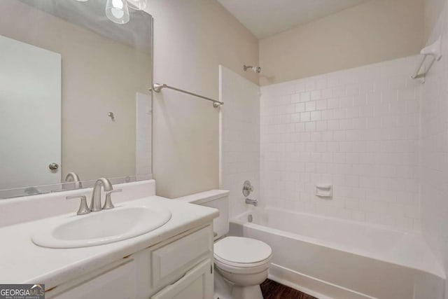 full bathroom with vanity, toilet, and tiled shower / bath