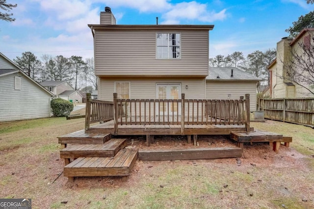 back of house featuring a wooden deck