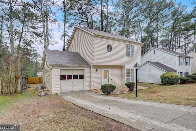 view of front property with a front lawn and a garage