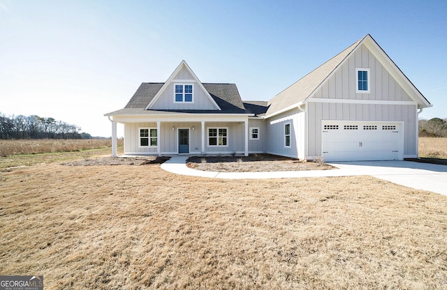 view of front of house featuring a porch and a garage