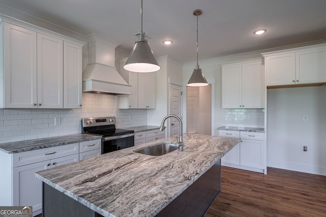 kitchen with pendant lighting, white cabinetry, sink, electric range, and custom range hood