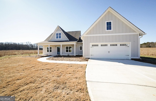 view of front of home featuring a garage and covered porch