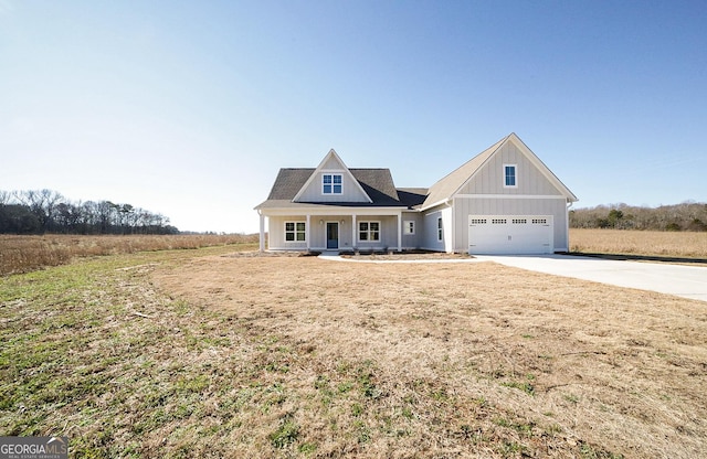 view of front of house with a garage and a porch