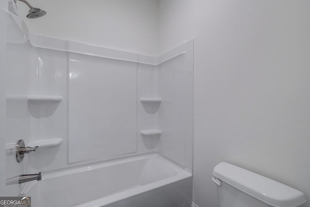 bathroom featuring toilet and shower / tub combination