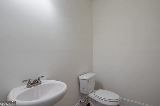 bathroom with toilet and sink