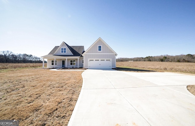 view of front of house with a garage and covered porch