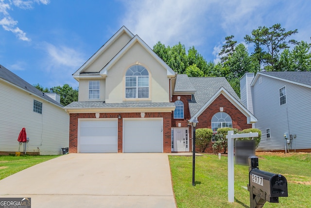 front facade featuring a garage and a front yard