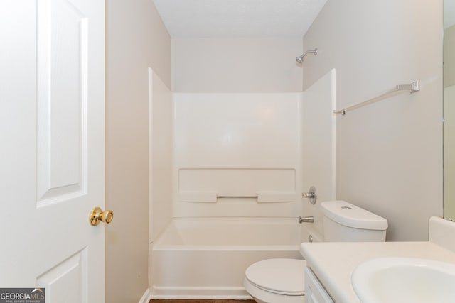 full bathroom featuring vanity, a textured ceiling, shower / bathtub combination, and toilet