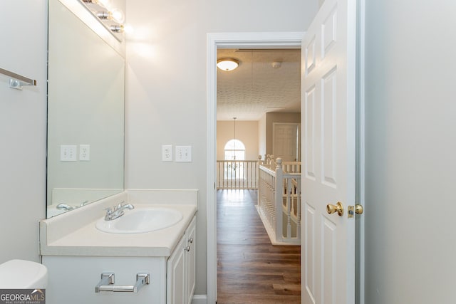 bathroom with vanity and hardwood / wood-style floors