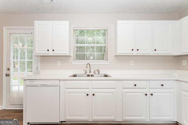 kitchen featuring white cabinetry, sink, a textured ceiling, and dishwasher