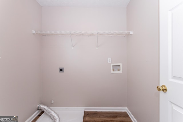 washroom featuring hardwood / wood-style floors, electric dryer hookup, and washer hookup