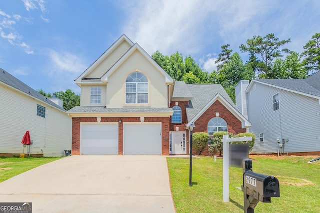 front facade featuring a garage and a front yard