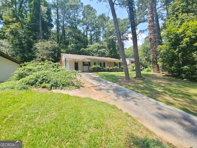 ranch-style house with a front lawn