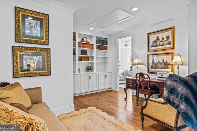 living room featuring crown molding and hardwood / wood-style floors