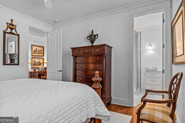 bedroom with ceiling fan, dark hardwood / wood-style floors, and crown molding