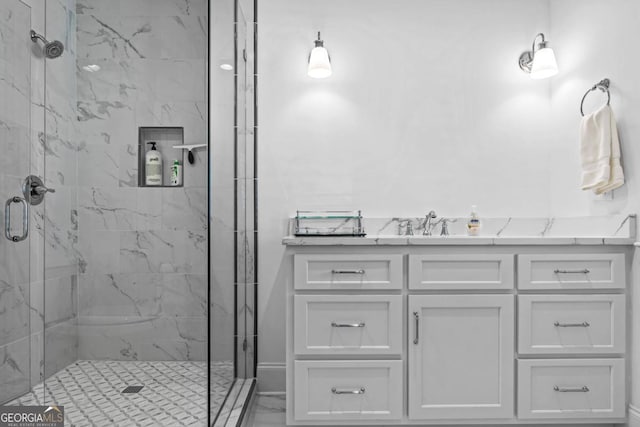 bathroom with an enclosed shower and vanity