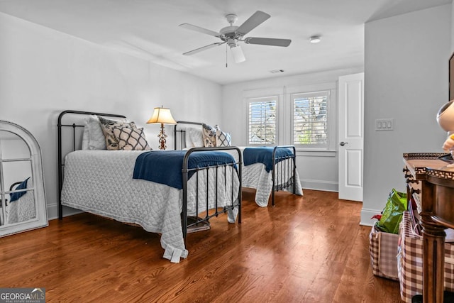 bedroom featuring ceiling fan and wood-type flooring