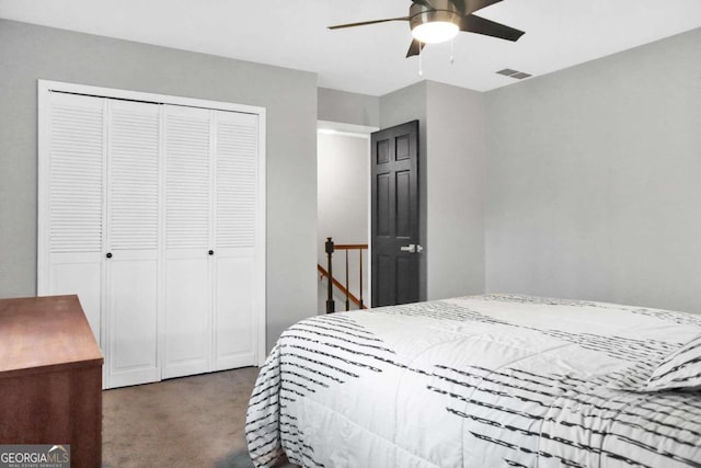 bedroom featuring ceiling fan, a closet, and dark colored carpet