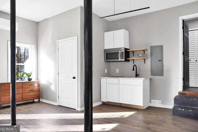 interior space featuring dark hardwood / wood-style flooring and sink