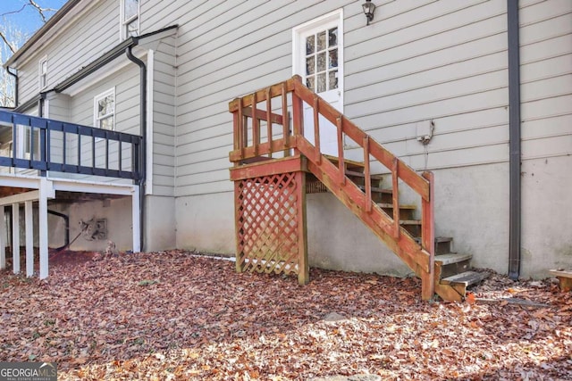 view of property exterior with a deck