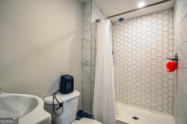 bathroom featuring sink and toilet