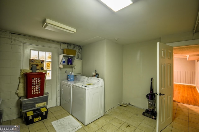 washroom featuring independent washer and dryer and light hardwood / wood-style floors