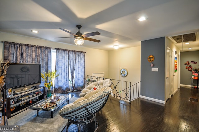 living room featuring ceiling fan and dark hardwood / wood-style floors