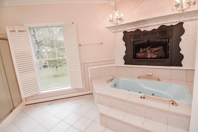 bathroom featuring a notable chandelier, tile flooring, and plenty of natural light