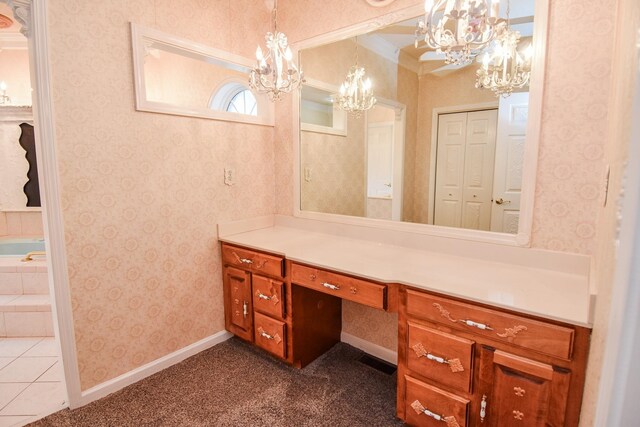 bathroom featuring crown molding, tile flooring, a notable chandelier, and vanity